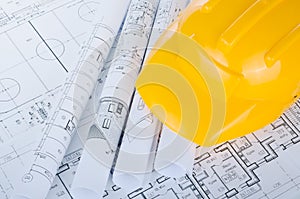 Helmet on the construction drawings isolated