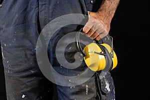 Helmet held by a construction worker. Protective clothing for ma