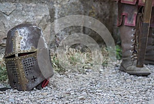 Helmet of a medieval knight on the ground