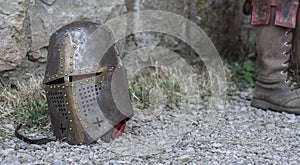 Helmet of a medieval knight on the ground