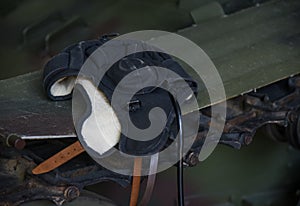 Helmet on an old Soviet tank in a military hangar