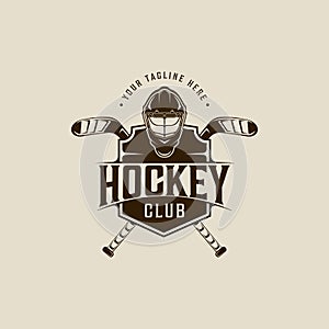 helmet and stick ice hockey logo vintage vector illustration template icon graphic design. winter sport sign or symbol with emblem