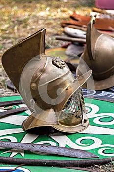 Helmets of armor and swords on the medieval military shield