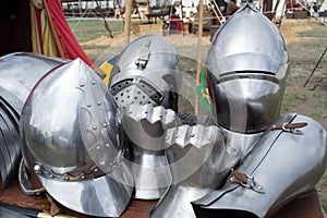 Helmets and pieces of medieval armor