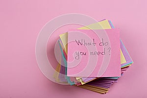 Help and advice concept - sticky note with text What do you need