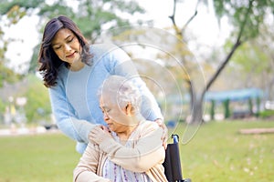 Help and care Asian senior or elderly old lady woman use walker with strong health while walking at park.