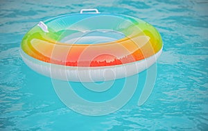Help for drowning person. Rubber circle, swimming pool. Summertime.