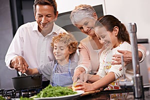 Help, happy kids or grandparents teaching cooking skills for a healthy dinner with vegetables diet at home. Learning