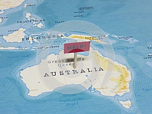 `HELP!` Sign with Pole on Australia of the World Map