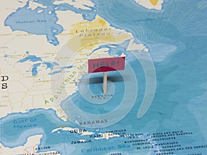 `HELP!` Sign with Pole on Bermuda of the World Map