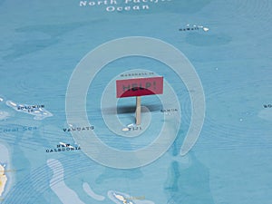 `HELP!` Sign with Pole on Fiji of the World Map
