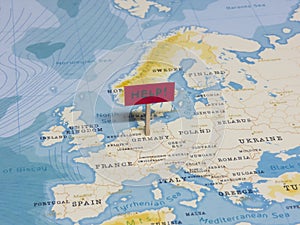 `HELP!` Sign with Pole on Germany of the World Map