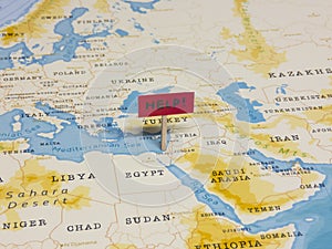 `HELP!` Sign with Pole on Israel of the World Map