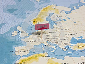 `HELP!` Sign with Pole on Liechtenstein of the World Map