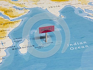 `HELP!` Sign with Pole on Mauritius of the World Map