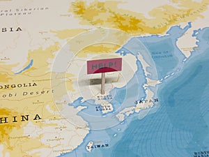 `HELP!` Sign with Pole on North Korea of the World Map