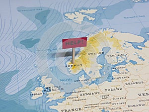 `HELP!` Sign with Pole on Norway of the World Map