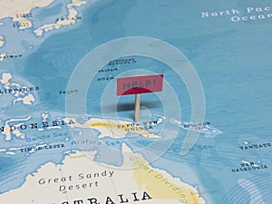 `HELP!` Sign with Pole on Papua New Guinea of the World Map