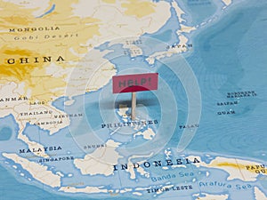 `HELP!` Sign with Pole on Philippines of the World Map
