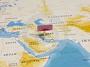 `HELP!` Sign with Pole on Qatar of the World Map