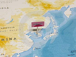 `HELP!` Sign with Pole on South Korea of the World Map