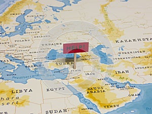 `HELP!` Sign with Pole on Syria of the World Map