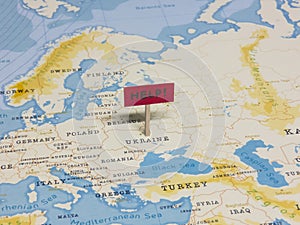 `HELP!` Sign with Pole on Ukraine of the World Map