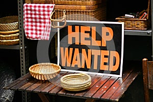 Help Wanted sign displayed in a shop in a job vacancy concept