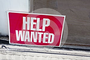 HELP WANTED Sign Inside Shop Window