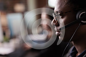 Helpdesk secretary listening to client on helpline call