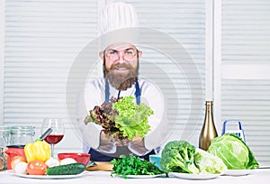 Helpful for healthy. Chef man in hat. Secret taste recipe. Dieting and organic food, vitamin. Bearded man cook in