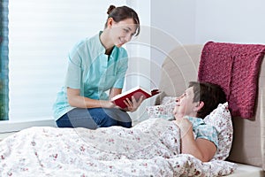 Helpful nurse reading book