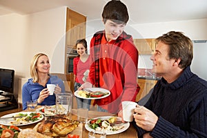 Helpful Teenage Children Serving Food