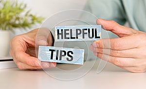 Helpful tips word written on wood block. helpful tips text on table, concept