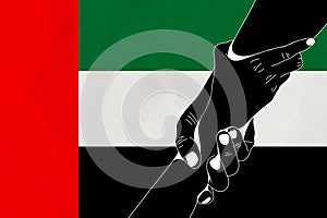 Helping hand against the United Arab Emirates flag. The concept of support. Two hands taking each other. A helping hand for those