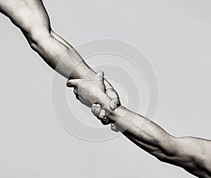 Helping hand concept and international day of peace, support. Closeup. Helping hand outstretched, isolated arm
