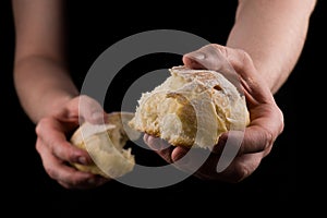 Helping hand giving a piece of bread. Man giving Bread, Helping Hand Concept.