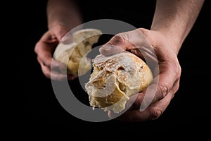 Helping hand giving a piece of bread. Man giving Bread, Helping Hand Concept.