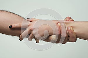 Helping hand. Holding hand, close up. Giving a helping hand. Rescue, helping gesture or hands. Salvation relations. Hand