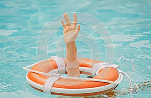 Helping hand. Life problems. Drowning person. Rescue swimming ring in water. Safety water equipment.