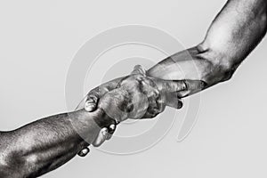 Helping hand outstretched, isolated arm, salvation. Close up help hand. Two hands, helping arm of a friend, teamwork photo