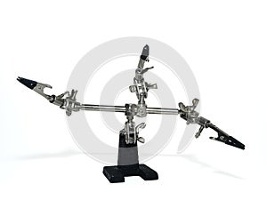 Helping hand, third hand or auxiliary clip tool, platinum holder in front of a white background