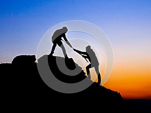 helping hand between two climber