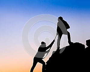 Helping hand between two climber