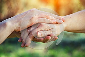 Helping hands for aged people, rehabilitation, hospice and nursing home care, service, elderly people care concept photo