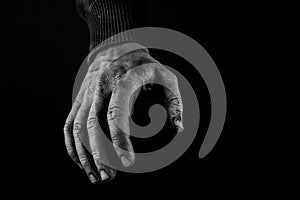 Helping hands concept, Man`s hands reaching out, asking for help, black and white