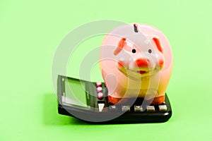 Helping make smart financial choices. Pay taxes. Taxes calculator. Accounting business. Piggy bank symbol money savings