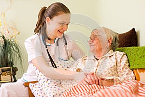 Helping a sick elderly woman photo