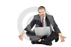 Helpless businessman with laptop in his lap