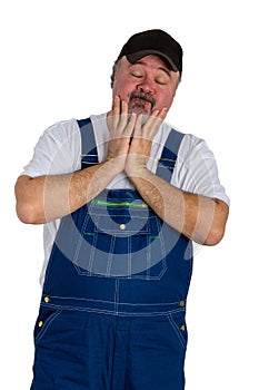 Helpless man wearing dungarees on white background